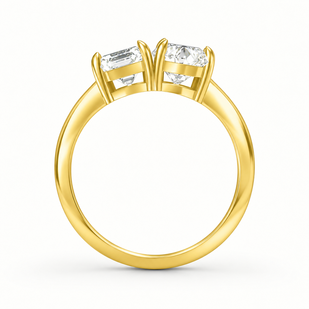 Top view of radiant cut and pear cut toi et moi diamond ring in yellow gold
