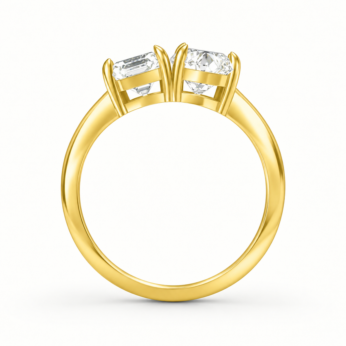 Top view of radiant cut and pear cut toi et moi diamond ring in yellow gold
