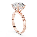 Rose gold ring with a large zircon on a white background 