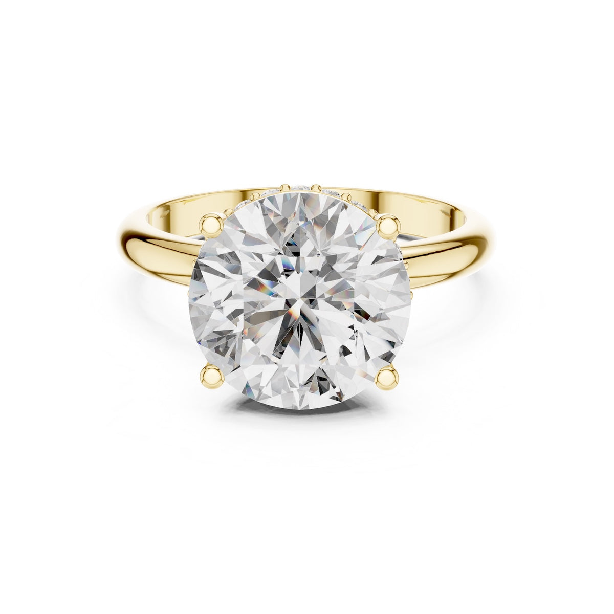 Gold ring with a large zircon on a white background 