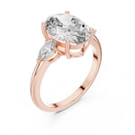 Rose-gold plated Silver ring with a oval-shaped center stone on a white background 