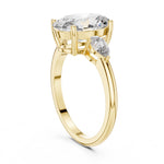 gold plated Silver ring with a oval-shaped center stone on a white background 