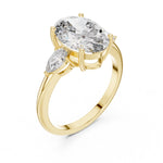 gold plated Silver ring with a oval-shaped center stone on a white background 