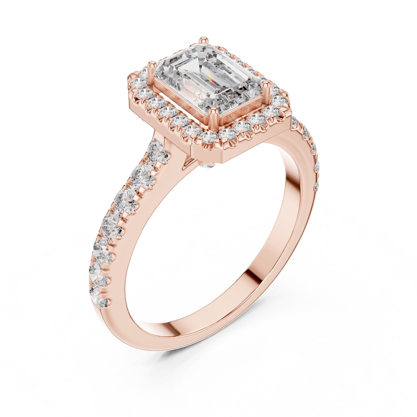Rose-gold plated Silver ring with a central emerald-cut stone and halo on a white background 