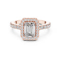 Rose-gold plated Silver ring with a central emerald-cut stone and halo on a white background #rose-gold