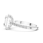 Silver ring with a central emerald-cut stone and halo on a white background 