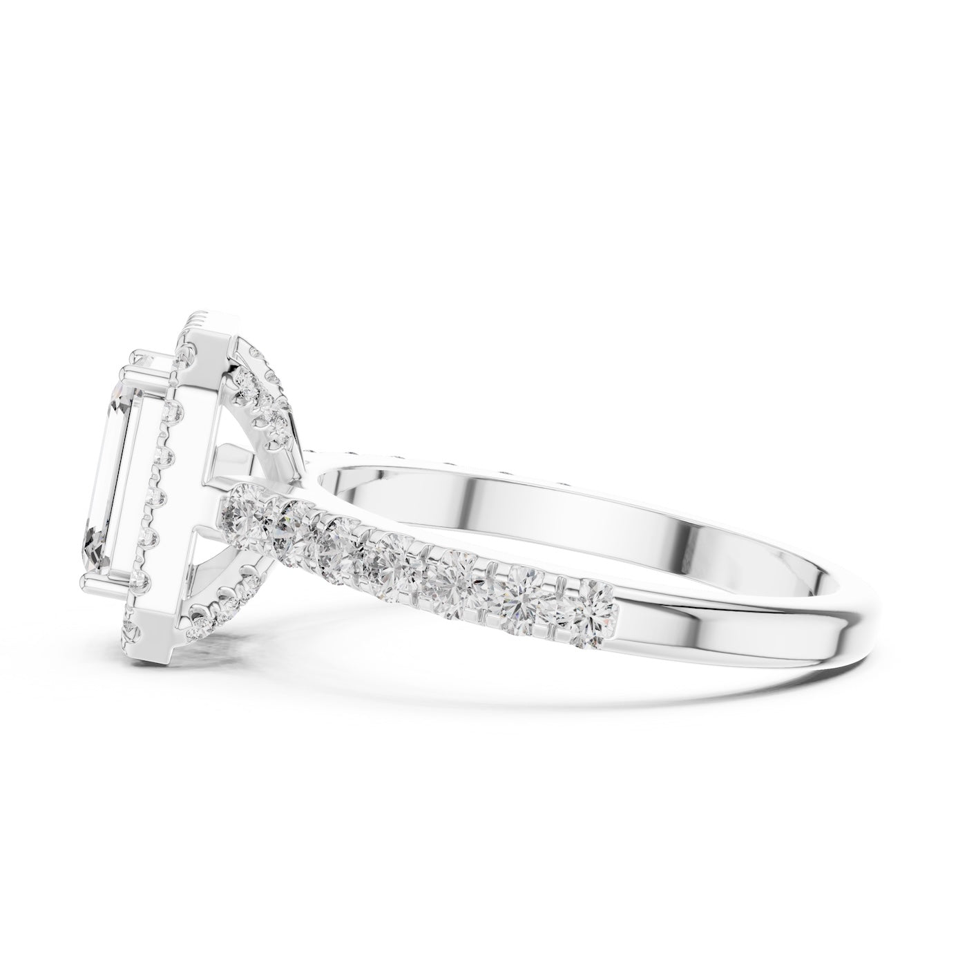 Silver ring with a central emerald-cut stone and halo on a white background 