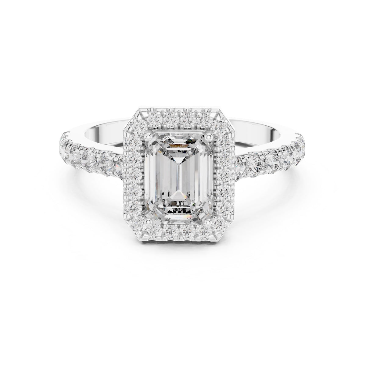 Silver ring with a central emerald-cut stone and halo on a white background 