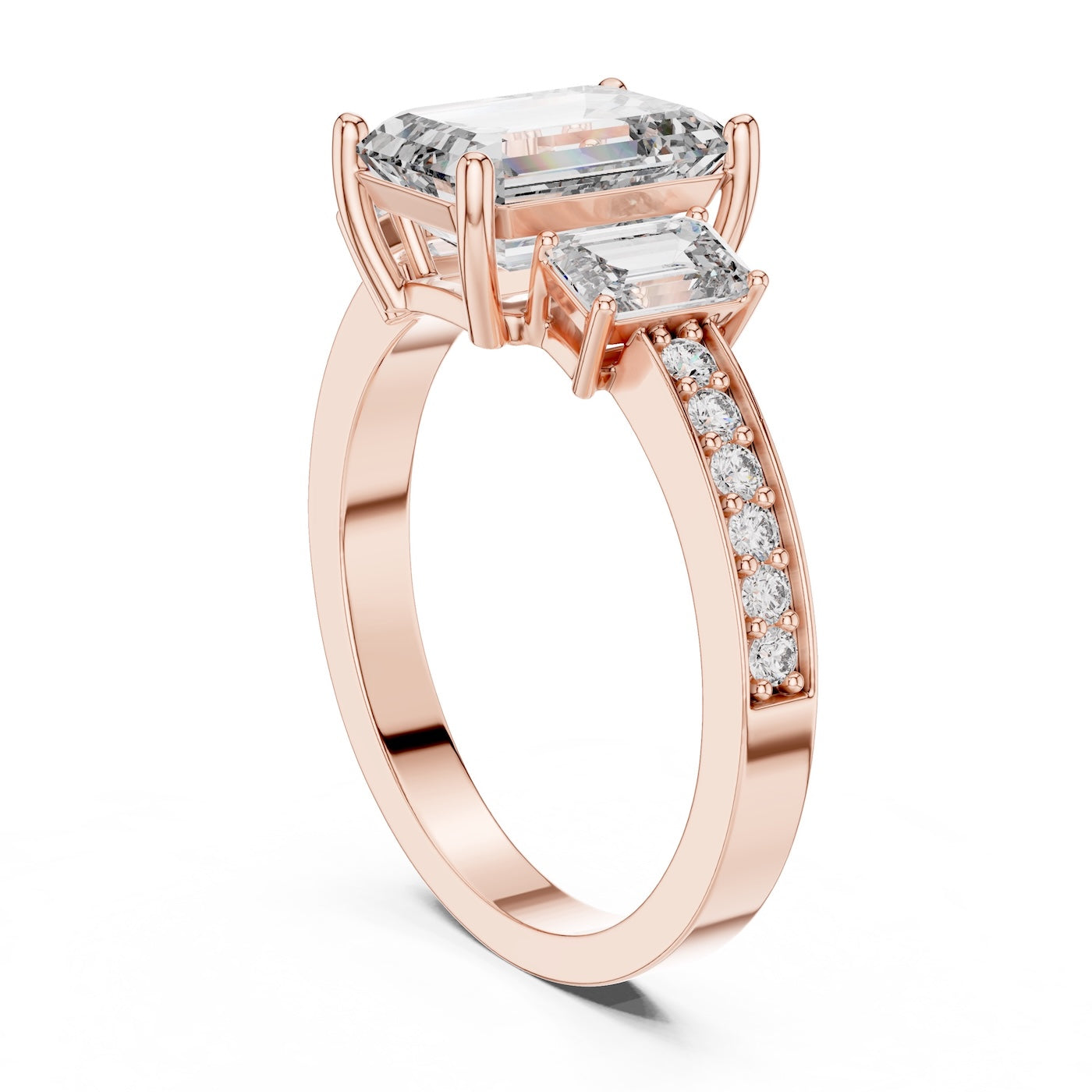 Rose-gold plated Silver ring with three emerald-cut center stones and smaller round stones on a white background 