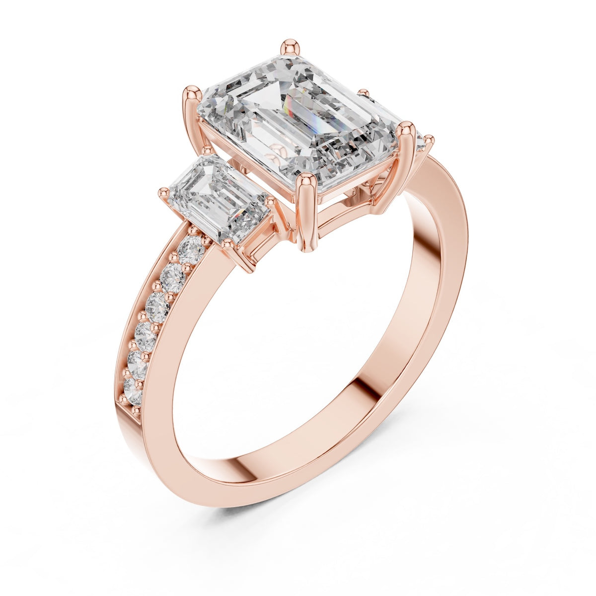 Rose-gold plated Silver ring with three emerald-cut center stones and smaller round stones on a white background 
