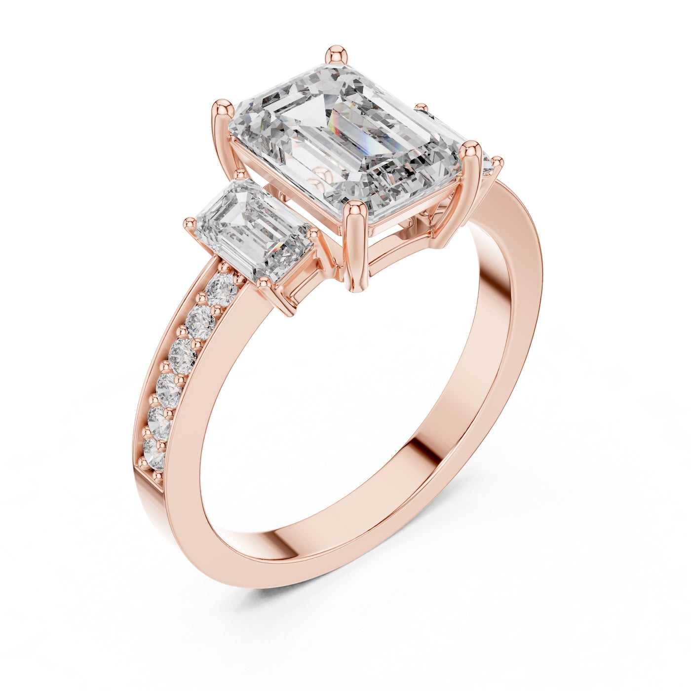 Rose-gold plated Silver ring with three emerald-cut center stones and smaller round stones on a white background 