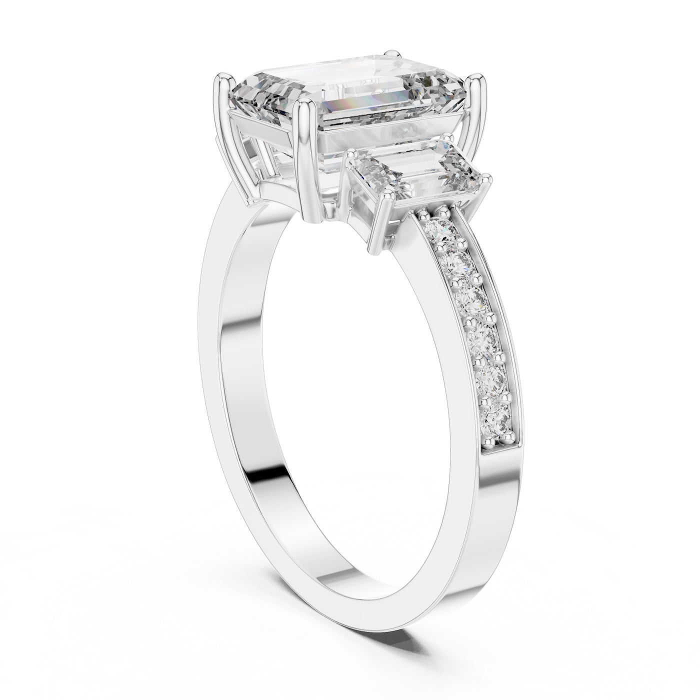 Silver ring with three emerald-cut center stones and smaller round stones on a white background 