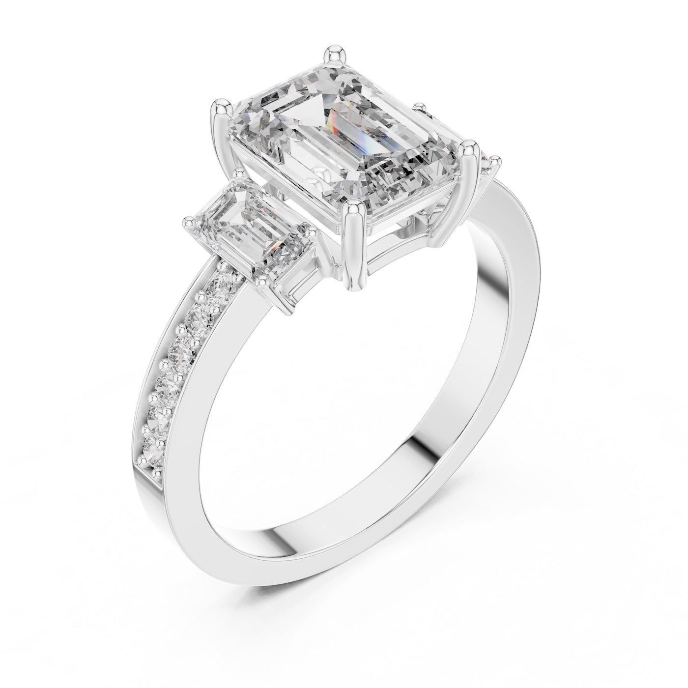 Silver ring with three emerald-cut center stones and smaller round stones on a white background 