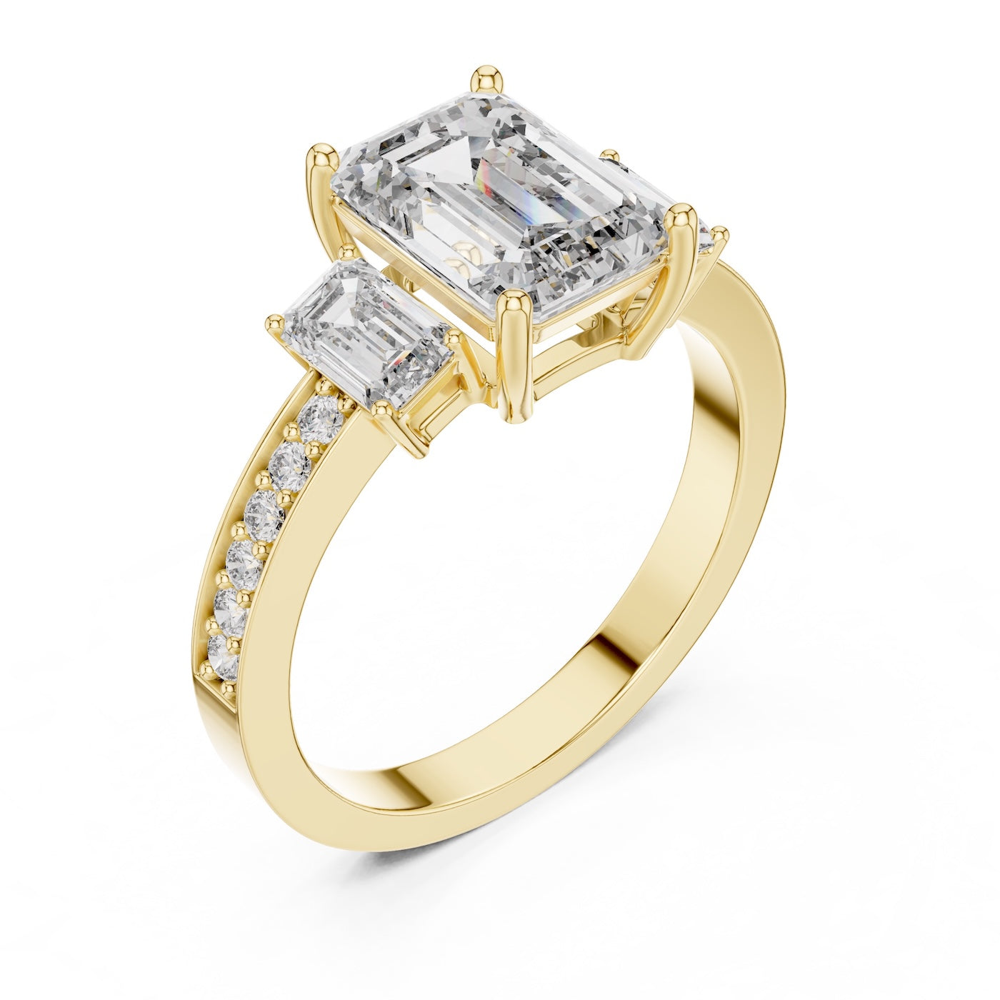 Gold plated Silver ring with three emerald-cut center stones and smaller round stones on a white background 