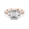 Rose-gold plated Silver ring with three emerald-cut center stones and smaller round stones on a white background #rose-gold