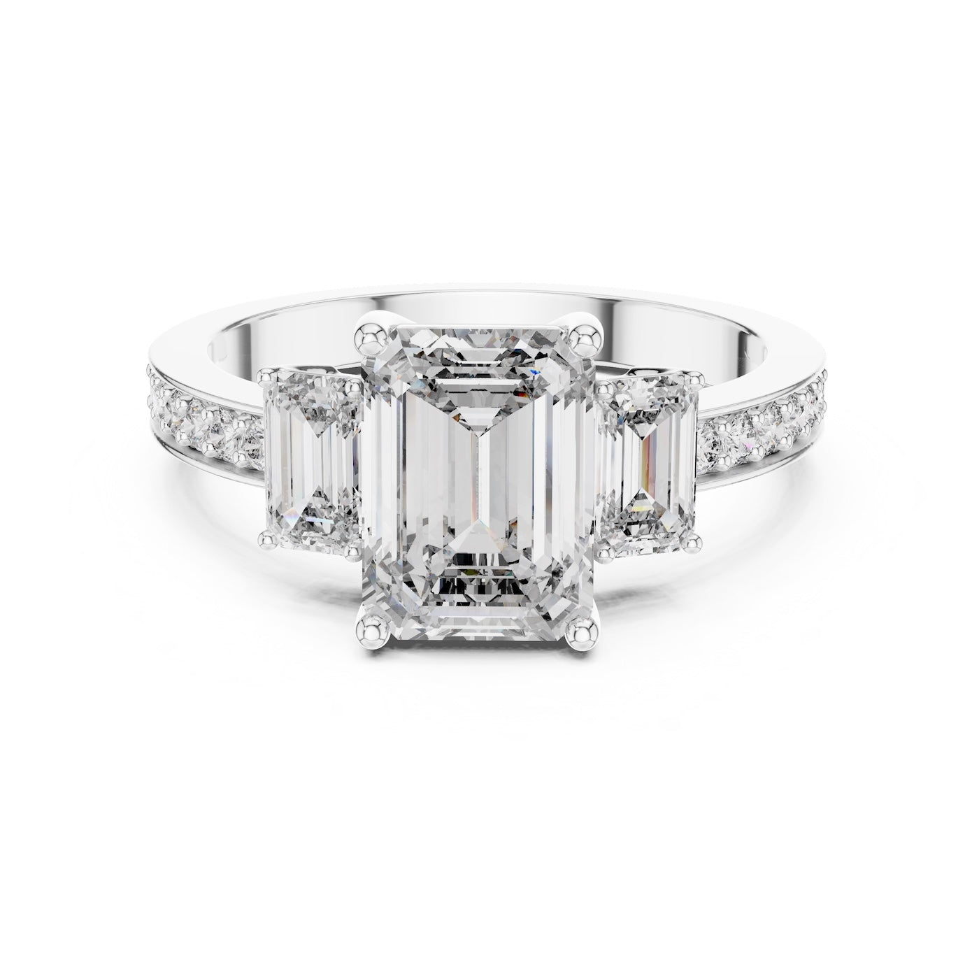 Silver ring with three emerald-cut center stones and smaller round stones on a white background 