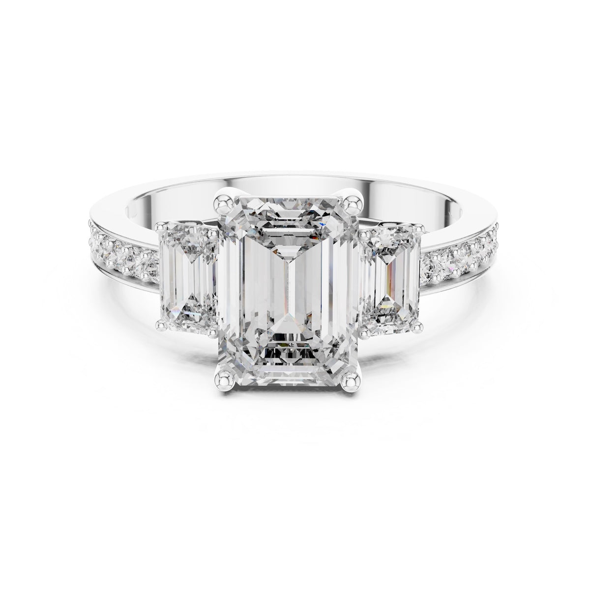 Silver ring with three emerald-cut center stones and smaller round stones on a white background #white-gold