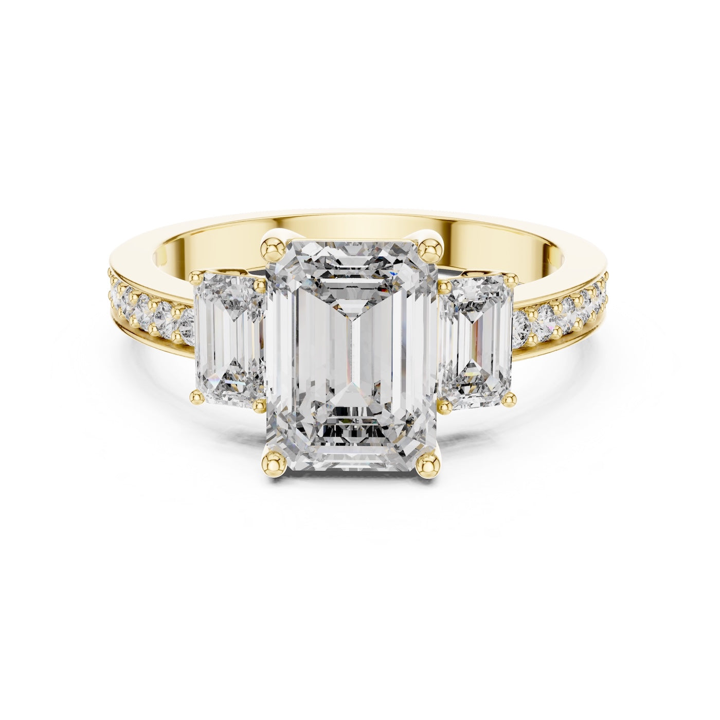 Gold plated Silver ring with three emerald-cut center stones and smaller round stones on a white background 