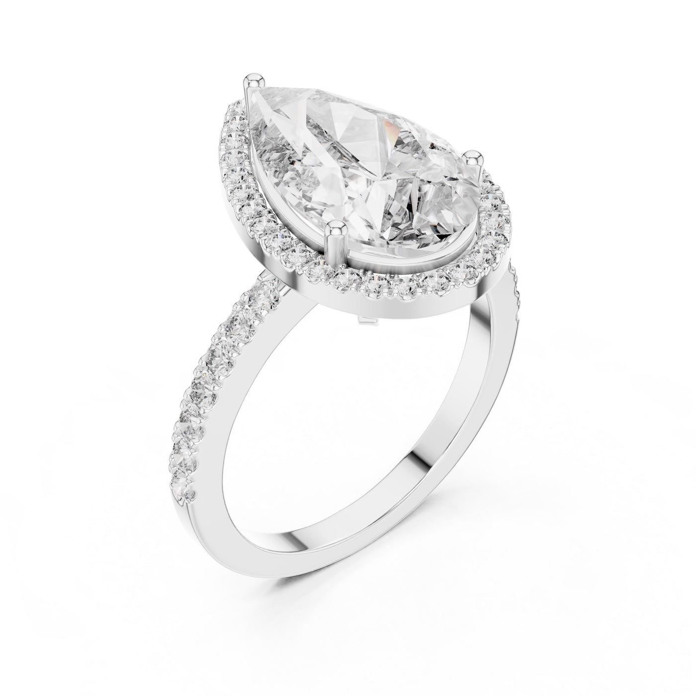 Silver ring with a pear-shaped center stone on a white background 