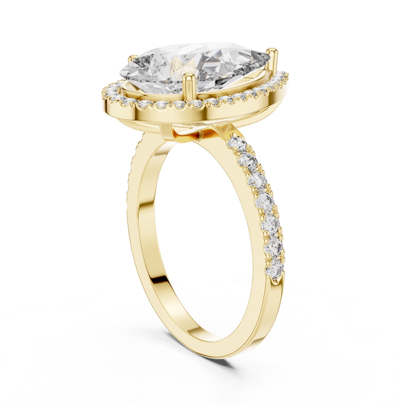 Gold plated silver ring with a pear-shaped center stone on a white background 