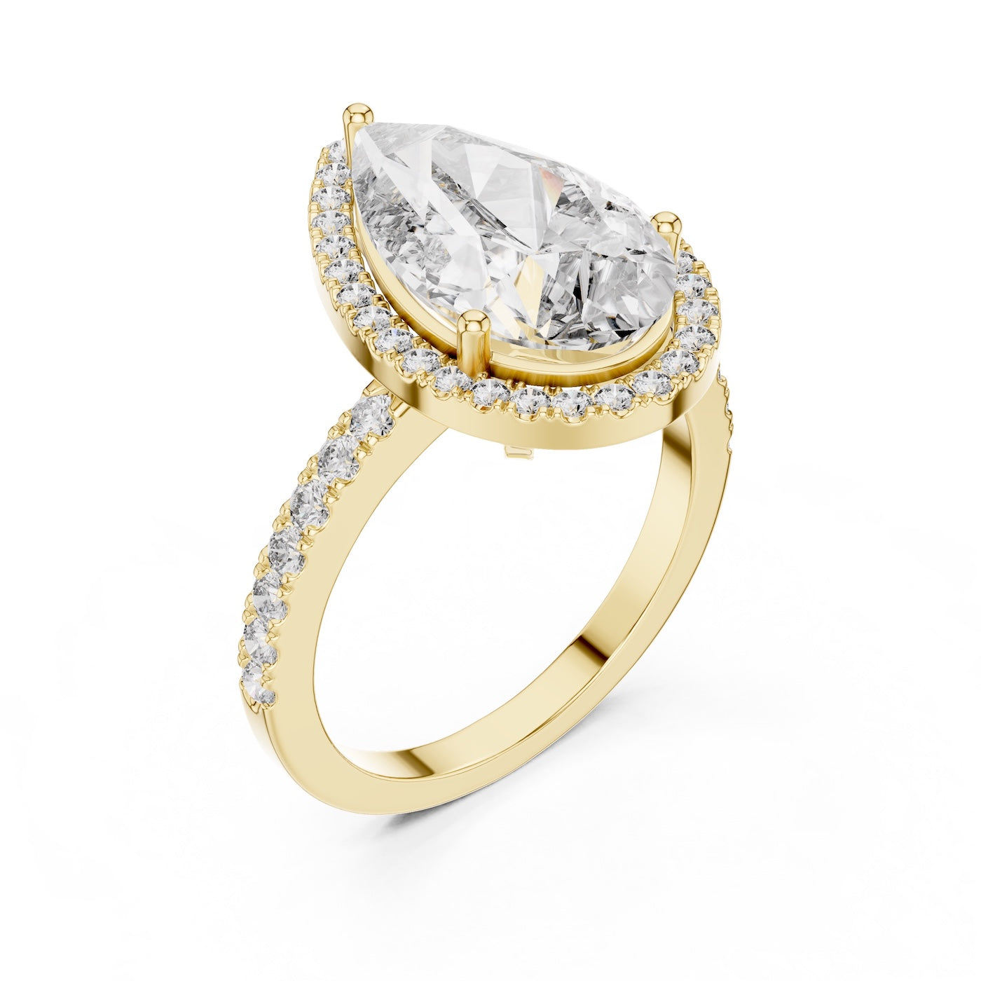 Gold plated silver ring with a pear-shaped center stone on a white background 