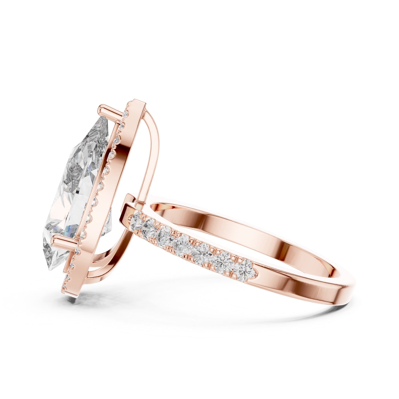 Rose-gold plated silver ring with a pear-shaped center stone on a white background 