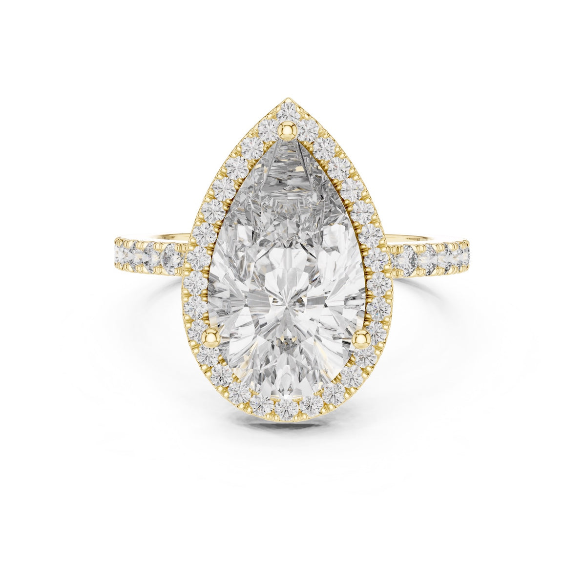 Gold plated silver ring with a pear-shaped center stone on a white background 