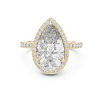 Gold plated silver ring with a pear-shaped center stone on a white background 