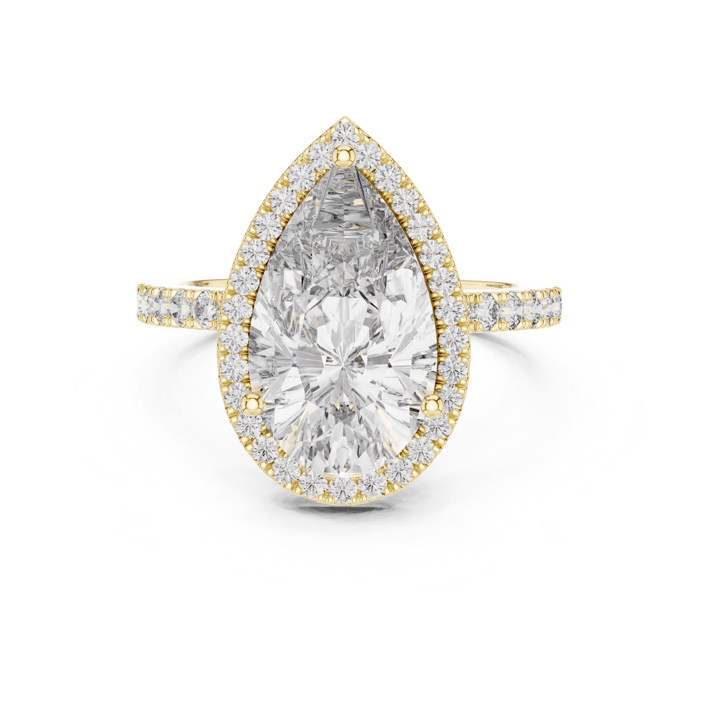 Gold plated silver ring with a pear-shaped center stone on a white background 