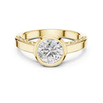 Gold plated Silver ring with a zircon diamond against a white background 