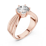 Rose-gold plated Silver ring with a large zircon on a white background 