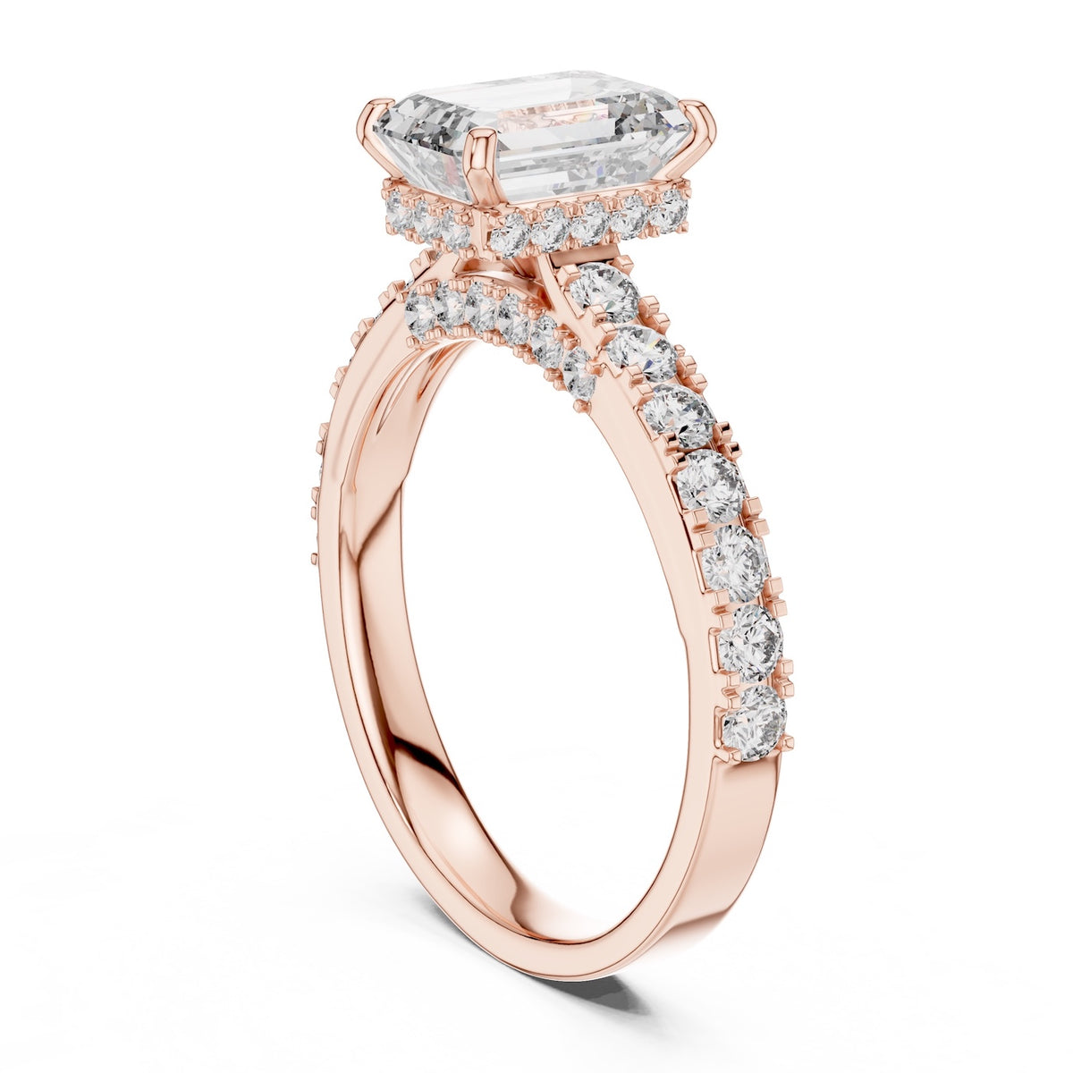 Rose-gold plated Silver ring with a central emerald-cut diamond and smaller diamonds on a white background 