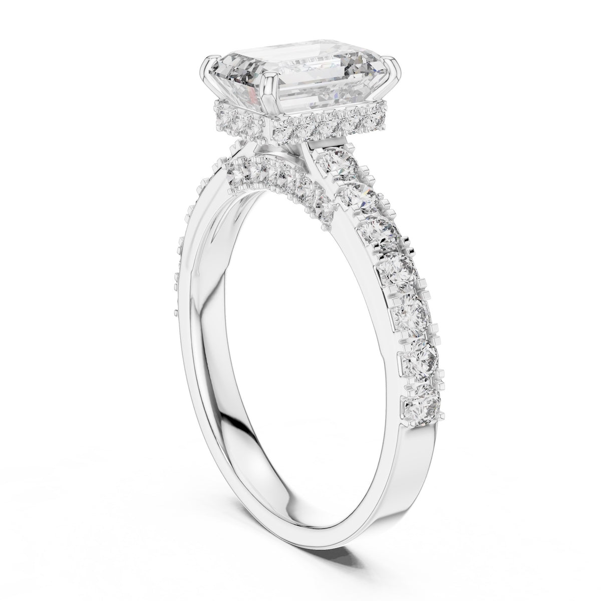 Silver ring with a central emerald-cut diamond and smaller diamonds on a white background 
