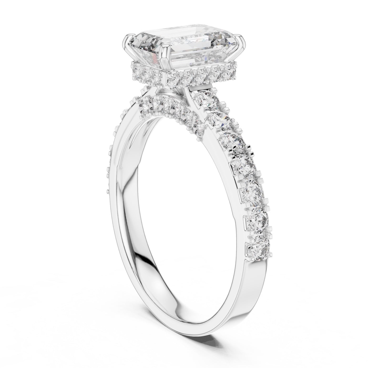 Silver ring with a central emerald-cut diamond and smaller diamonds on a white background 
