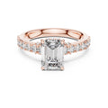 Rose-gold plated Silver ring with a central emerald-cut diamond and smaller diamonds on a white background #rose-gold
