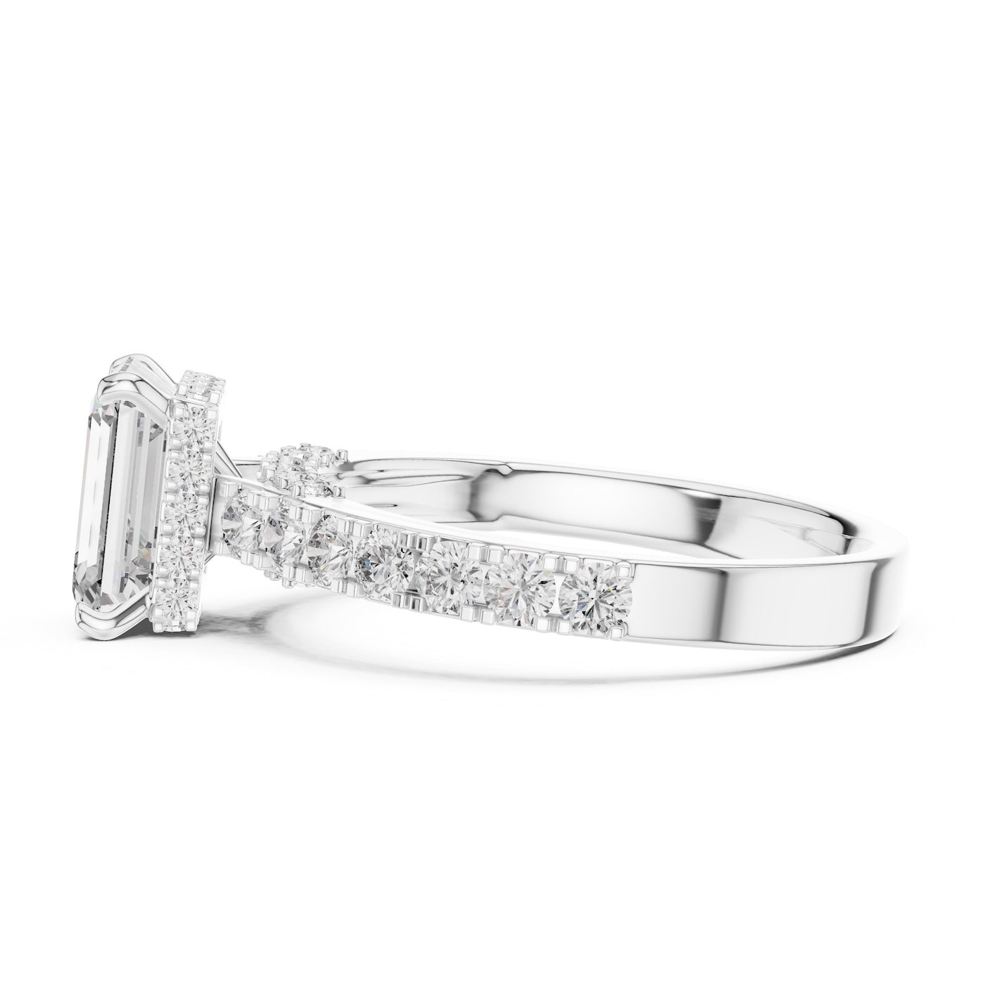 Silver ring with a central emerald-cut diamond and smaller diamonds on a white background 