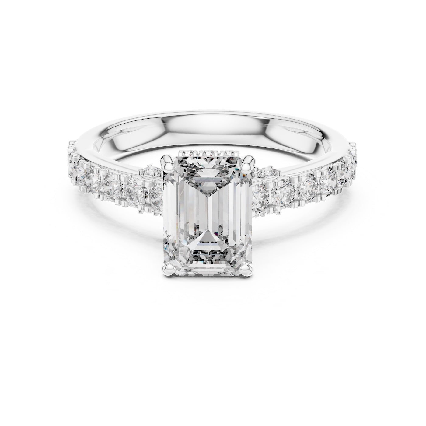 Silver ring with a central emerald-cut diamond and smaller diamonds on a white background 