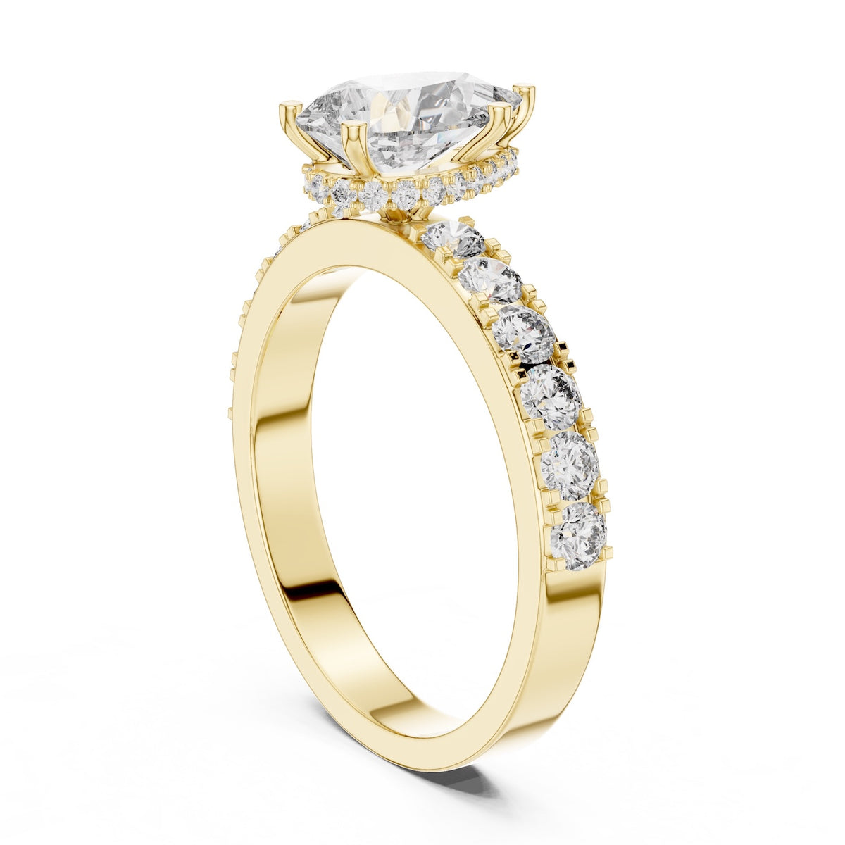 gold plated silver ring with a pear-shaped center stone on a white background 