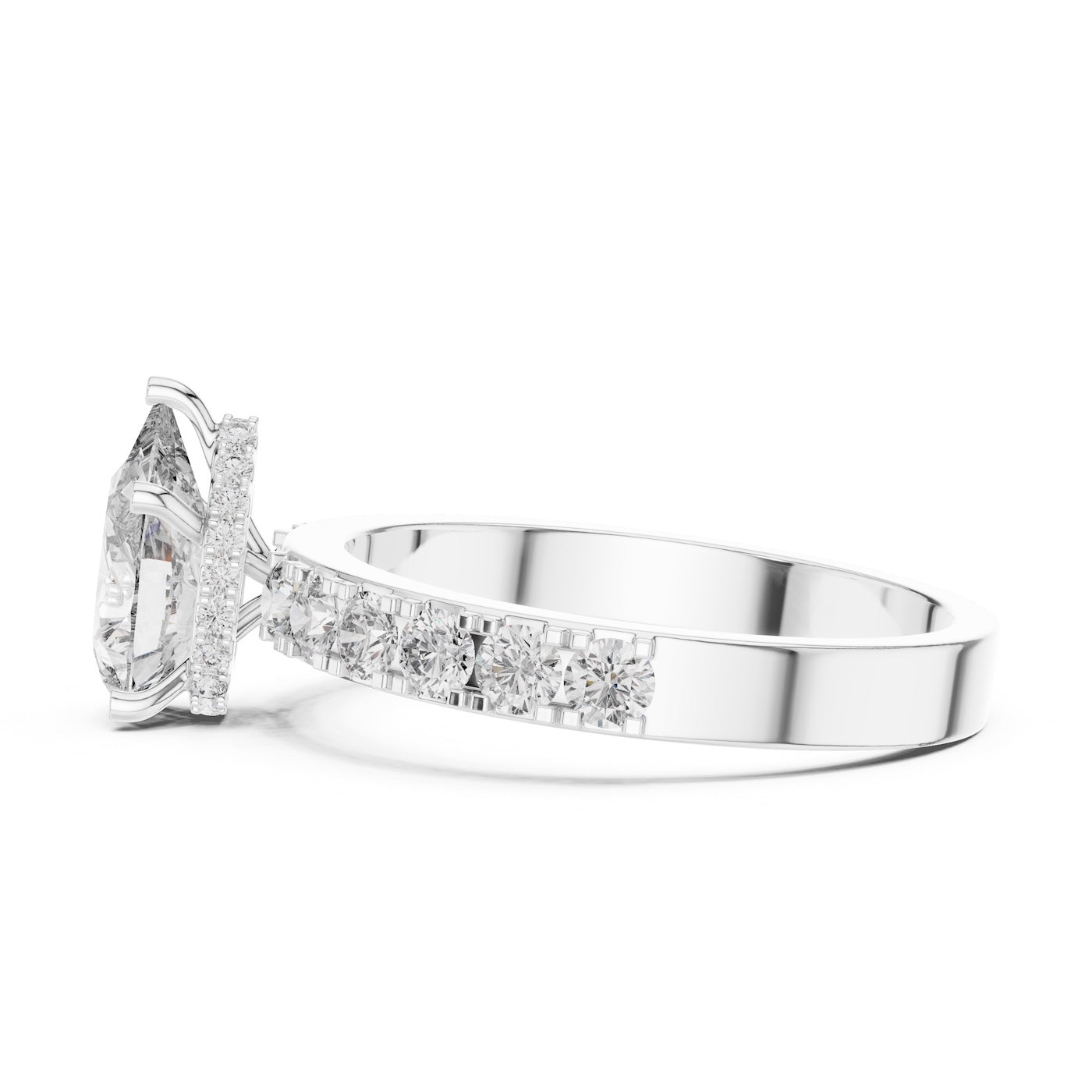Silver ring with a pear-shaped center stone on a white background