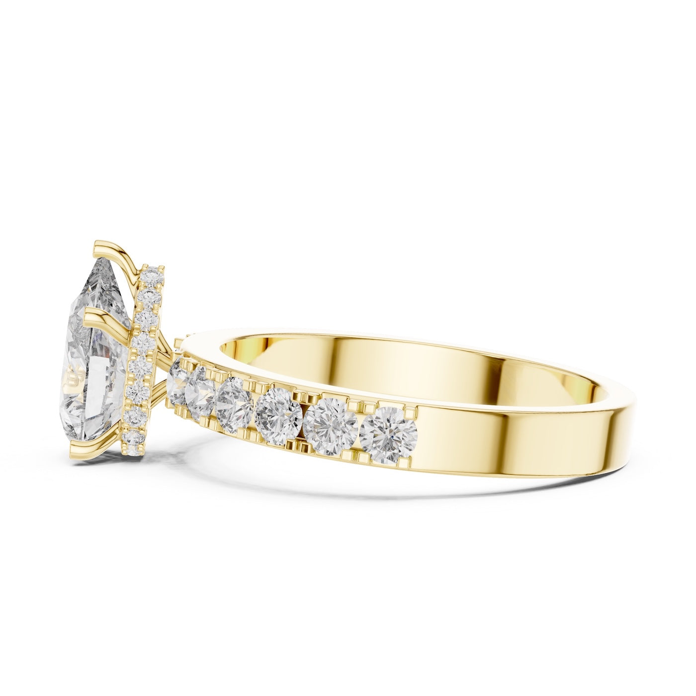 gold plated silver ring with a pear-shaped center stone on a white background 