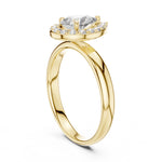 Gold-plated silver ring with pear-shaped center stone on a white background 