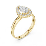 Gold-plated silver ring with pear-shaped center stone on a white background 