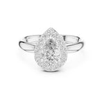Silver ring with pear-shaped center stone on a white background 