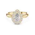 Gold-plated silver ring with pear-shaped center stone on a white background 