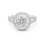 gold ring with a round diamond and studded band on a white background 