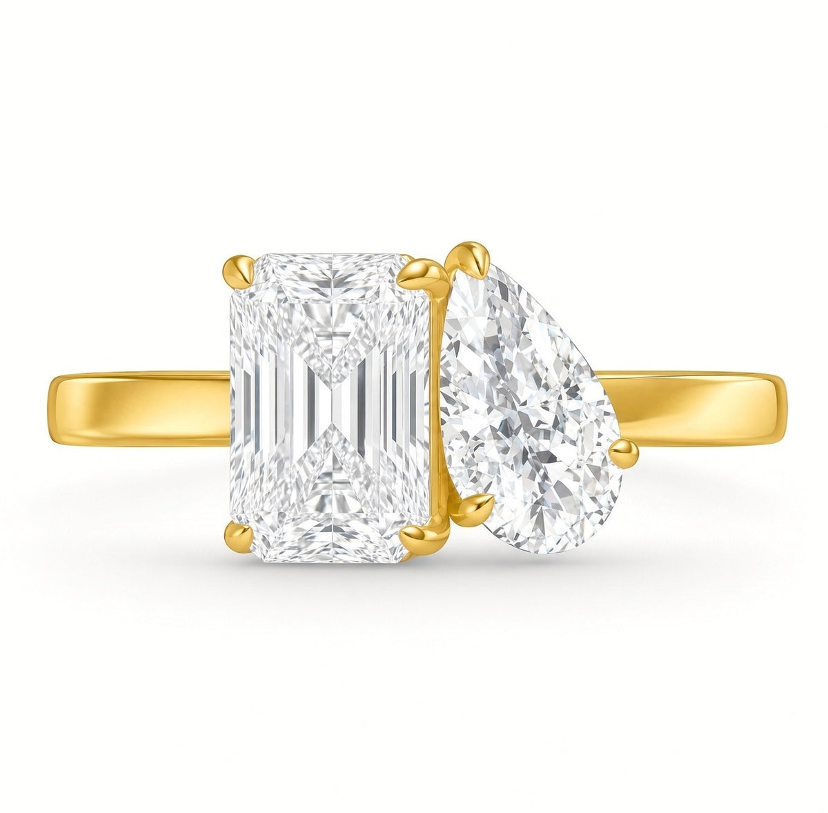 Two stone diamond ring in yellow gold seen end-on, radiant cut and pear cut lab grown diamonds side by side
